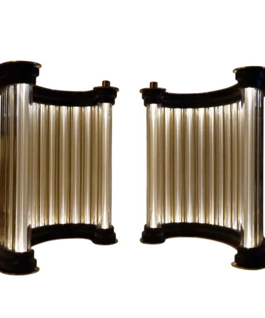 Pair of luminous golden column sculptures displayed together.