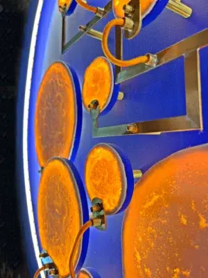 Detail of illuminated porcelain moons in the luminous sculpture Mater Nostra.