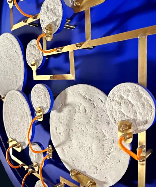 Brass circuit linking the luminous discs of Mater Nostra.